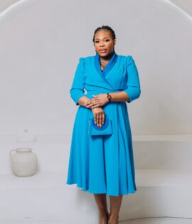 Blue A-line shaped dress with satin collar design and matching bag